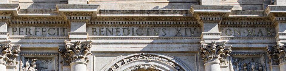 Latin text honors Pope Benedict XIV on the Trevi Fountain Rome