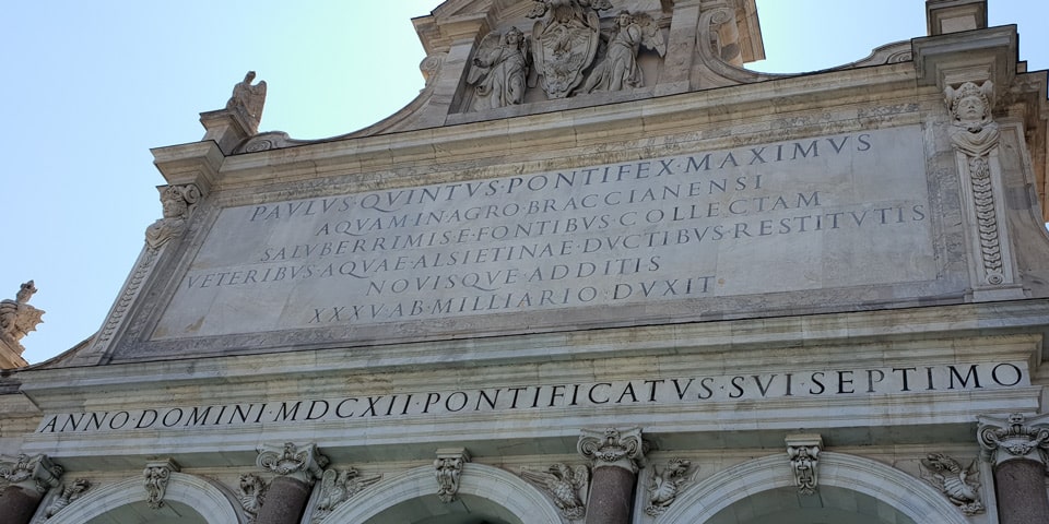 Latin dedication inscription on the Fontana dell'Acqua Paola crediting the Aqua Alsietina, with the date 1612, Rome