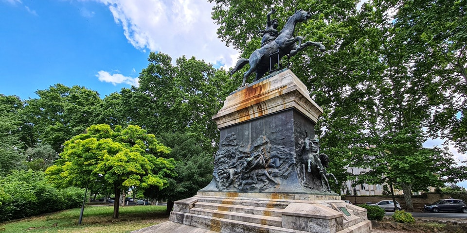 Full view of the Anita Garibaldi equestrian monument with its rearing horse and relief-covered pedestal in Rome