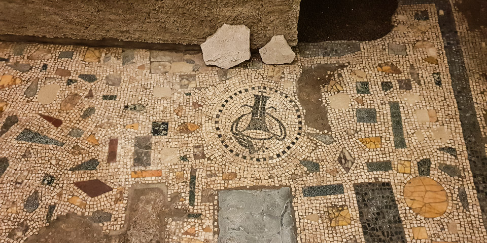 antique roman mosaic on the floor Basilica di Santa Cecilia in Trastevere