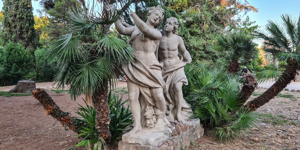 Eighteenth-century sandstone group of Apollo pursuing Daphne at Villa Sciarra in Rome