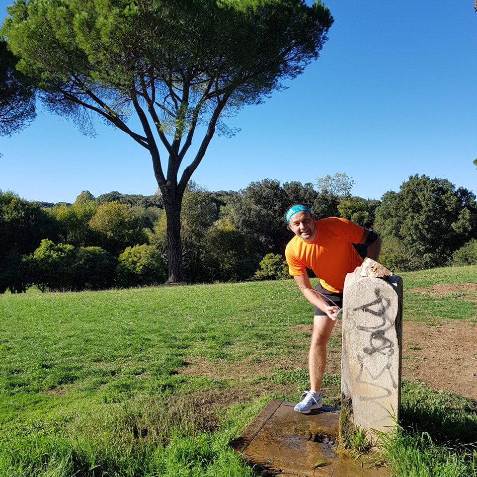 Artur Jakucewicz stopping at a drinking fountain during an October run in Villa Doria Pamphilj
