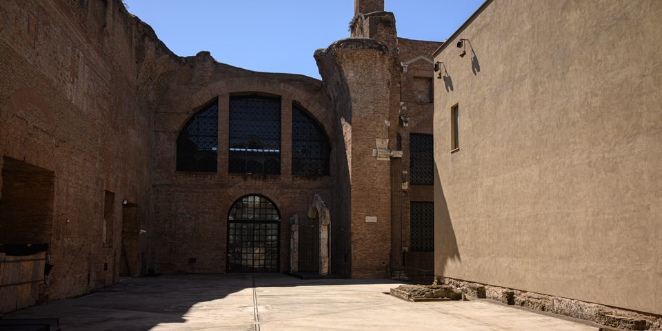 Massive ancient brick walls and thermal window of the Baths of Diocletian ruins, Rome