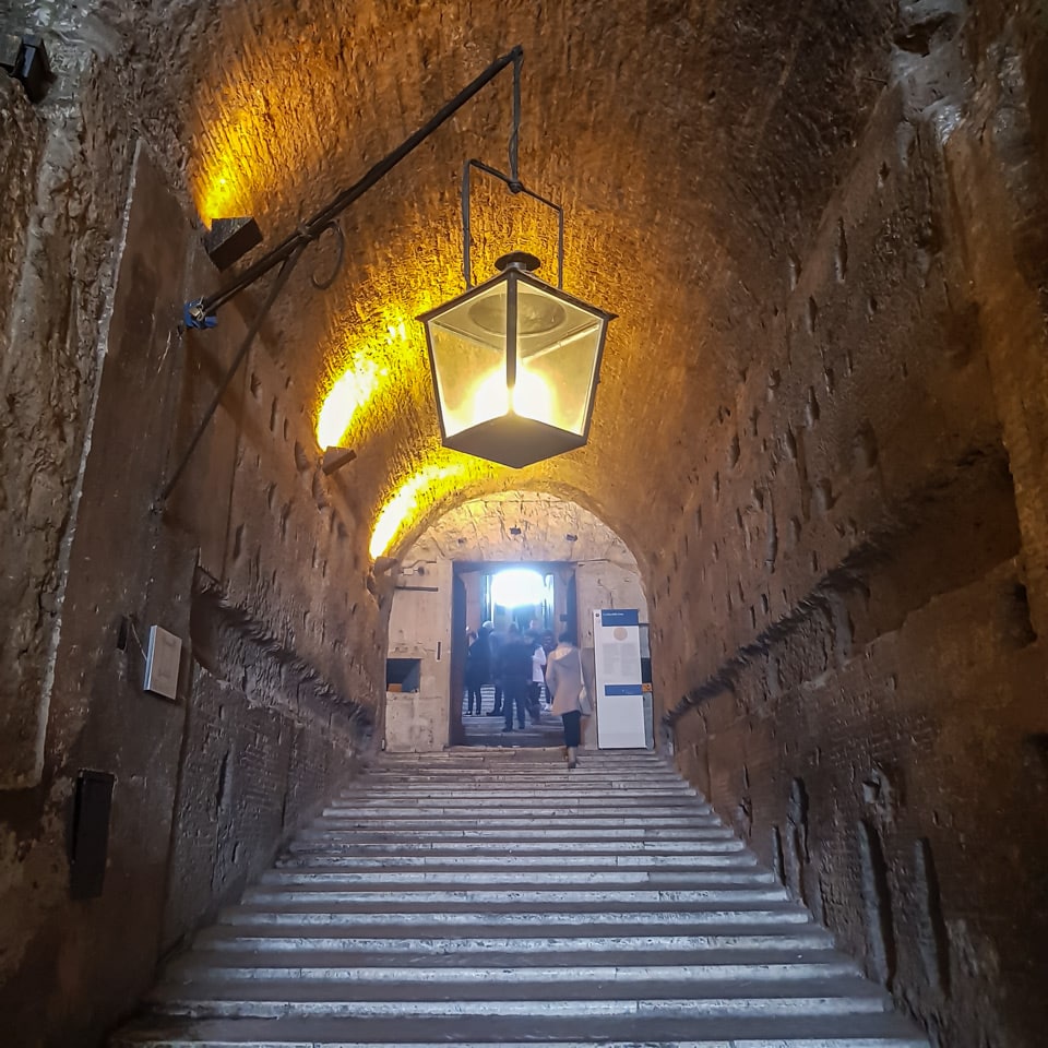 Ancient spiral ramp of Hadrian's mausoleum with a hanging lantern inside Castel Sant'Angelo, Rome