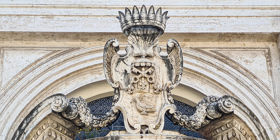 large stone coat of arms belongs to Cardinal Camillo Francesco Maria Pamphilj