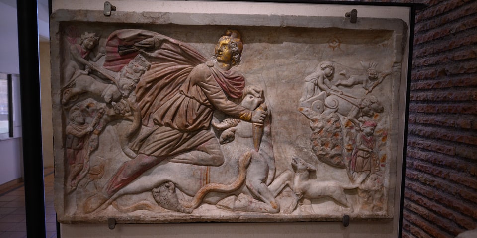 Roman marble relief of Mithras slaying the bull (tauroctony) with traces of colour and gilding, Baths of Diocletian museum, Rome