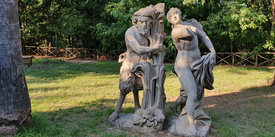 Sandstone group of Pan holding reeds beside the nymph Syrinx at Villa Sciarra in Rome