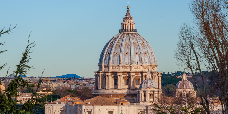 Close telephoto view of St. Peter's Basilica dome from Piazzale Garibaldi, showing the ribbed structure and lantern in detail, Rome