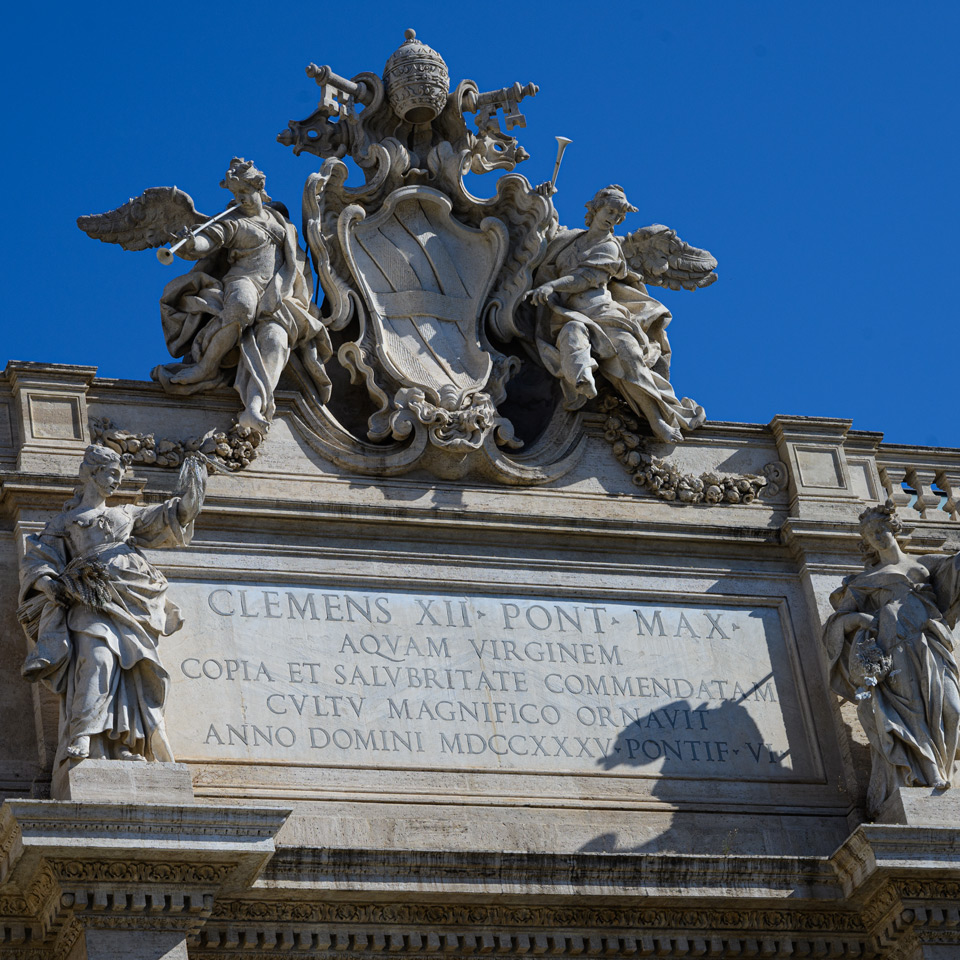 Main Latin inscription of Clement XII dated 1735 beneath the Corsini coat of arms on the Trevi Fountain
